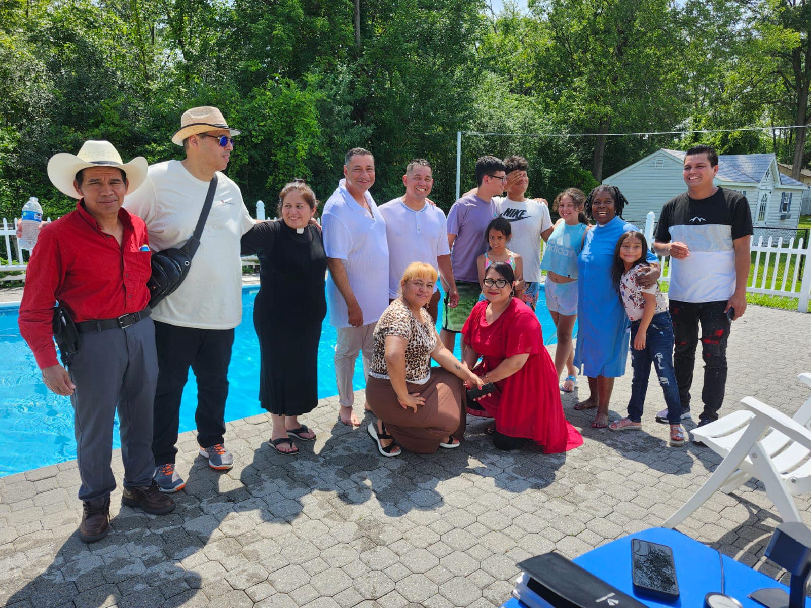 A group of members from Least Of These Community Center gathered outdoors, building faith and community.